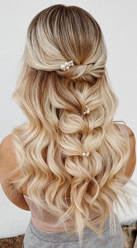 Elegant prom hairstyle featuring a single thick braid cascading down the back