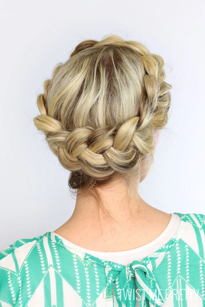 Elegant prom hairstyle featuring a twisted halo braid with soft curls