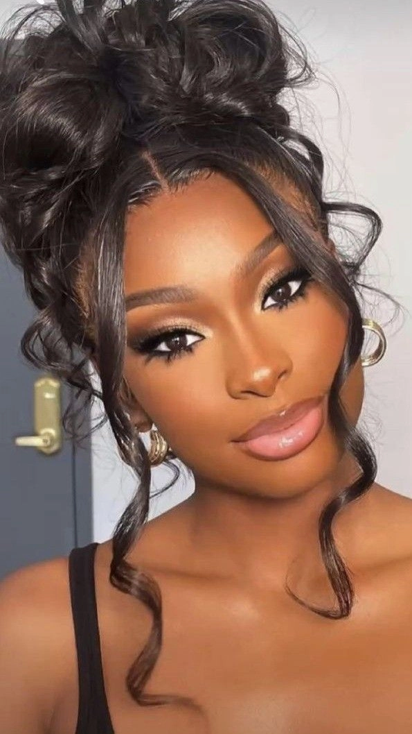 Elegant updo showcasing prom hairstyles to match a black dress