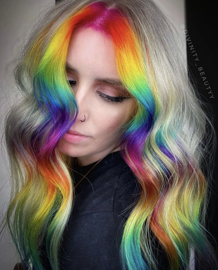 Elegant prom updo showcasing vivid rainbow color treated hair