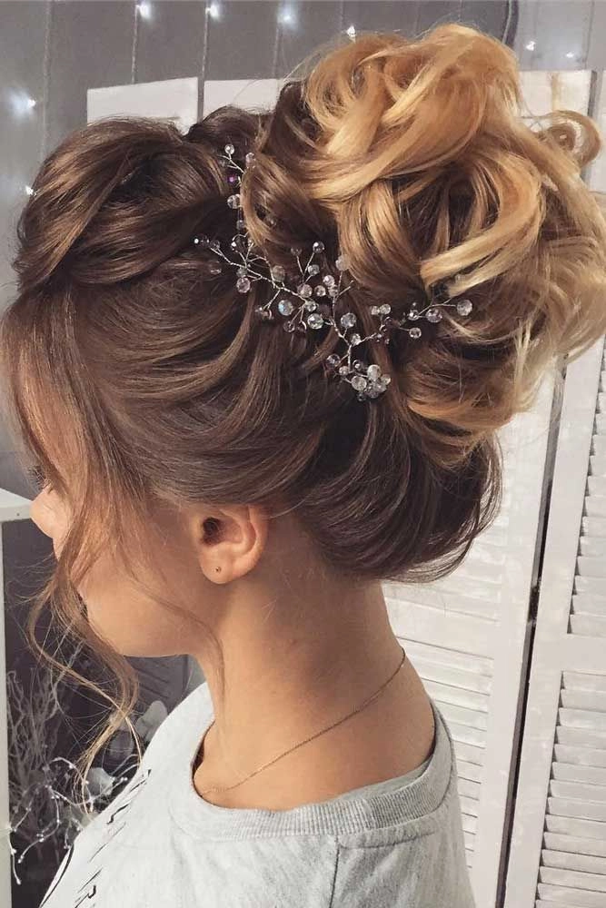 Chic prom hairstyle featuring a sophisticated updo on short layered hair Elegant prom updo for short layered hair with soft curls and volume