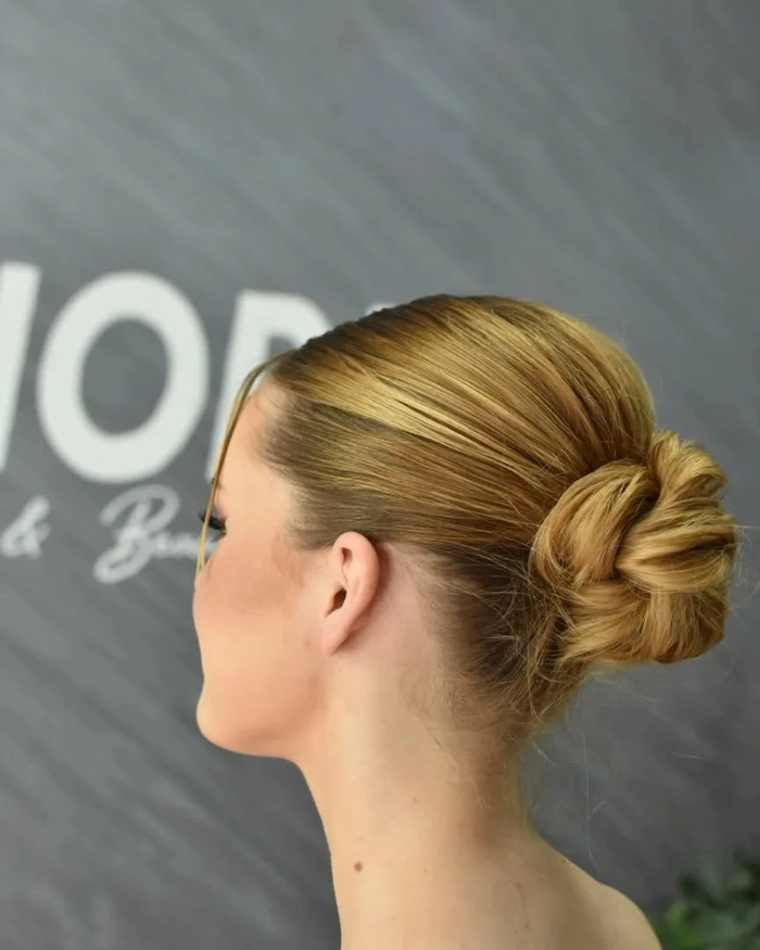 Chic and stylish prom updo for short layered hair trending in 2024 Elegant prom updo hairstyle for short layered hair with soft curls
