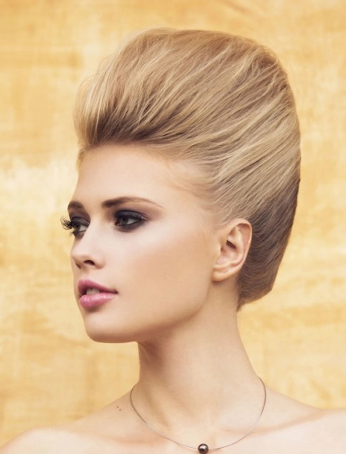 Sophisticated short layered hair prom hairstyle with a chic updo and subtle embellishments Elegant prom updo for short layered hair with soft curls and delicate accessories