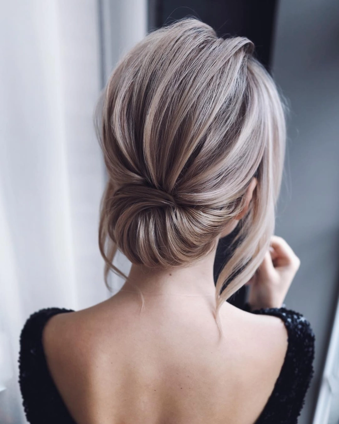 Chic and voluminous medium length prom updo for thick hair inspiration image 15 Elegant medium length prom updo hairstyle perfectly styled for thick hair