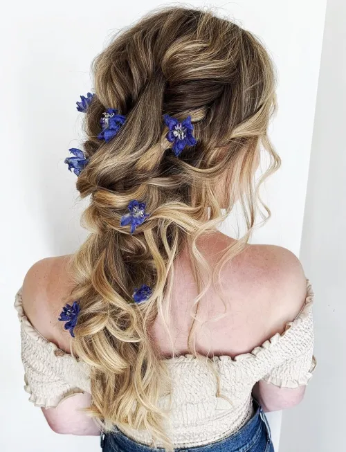 Beautiful prom hairstyle inspiration for high school senior celebrating graduation night Elegant senior prom hairstyle for high school graduates with soft curls and a delicate hair accessory