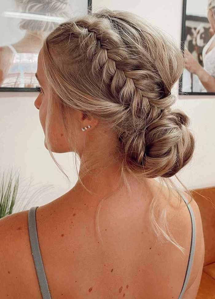 Elegant updo with beach waves perfect for prom hairstyles at a beach venue