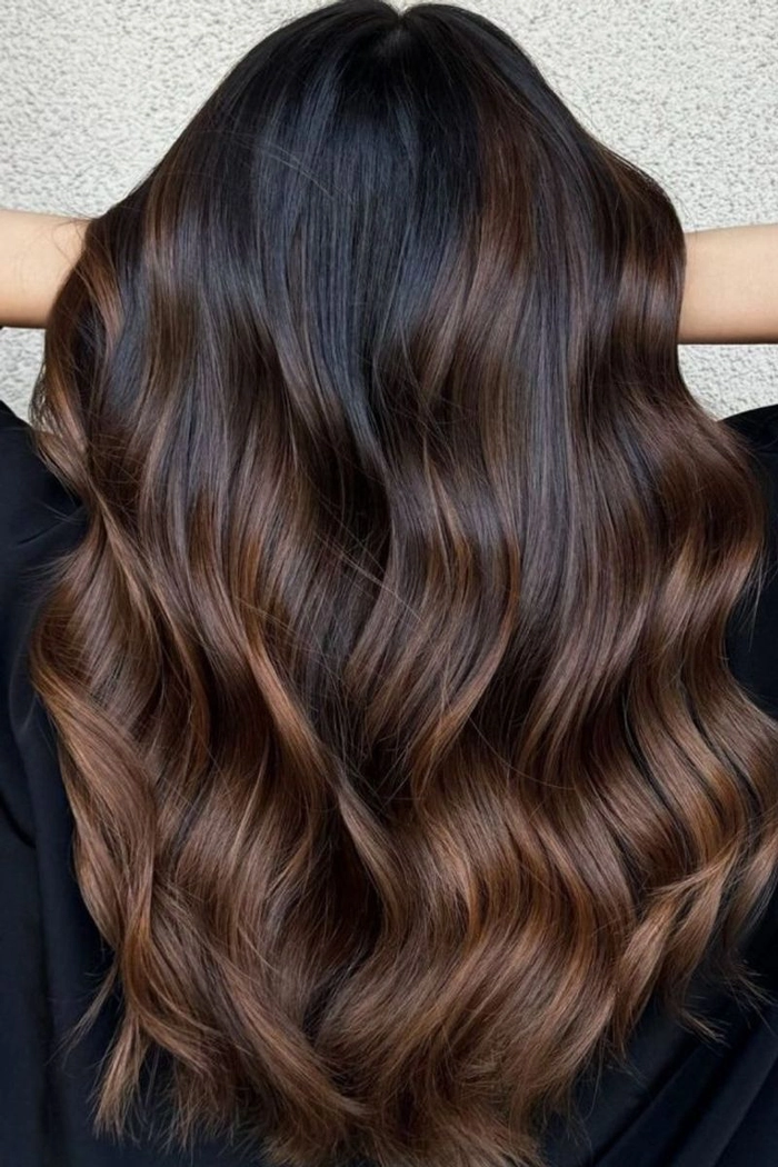 Elegant updo prom hairstyle showcasing caramel ombre hair with soft curls