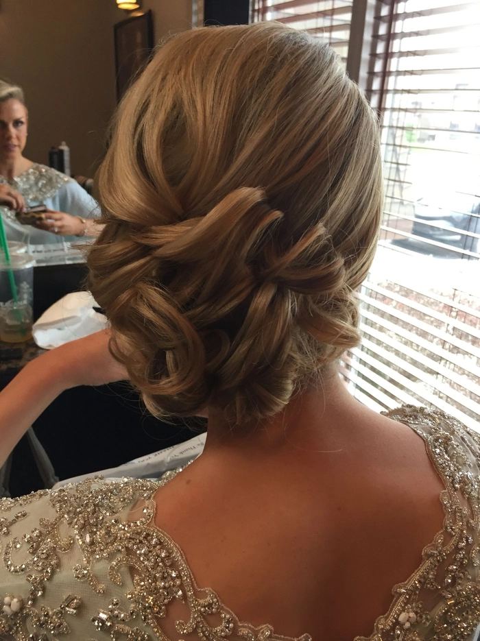 Stylish prom look with a chic updo complementing backless gowns Elegant updo prom hairstyle perfect for backless formal dresses