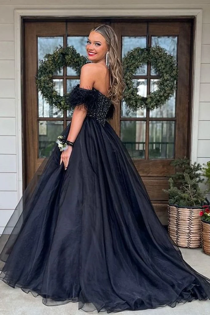 Elegant updo prom hairstyle complementing an off the shoulder dress
