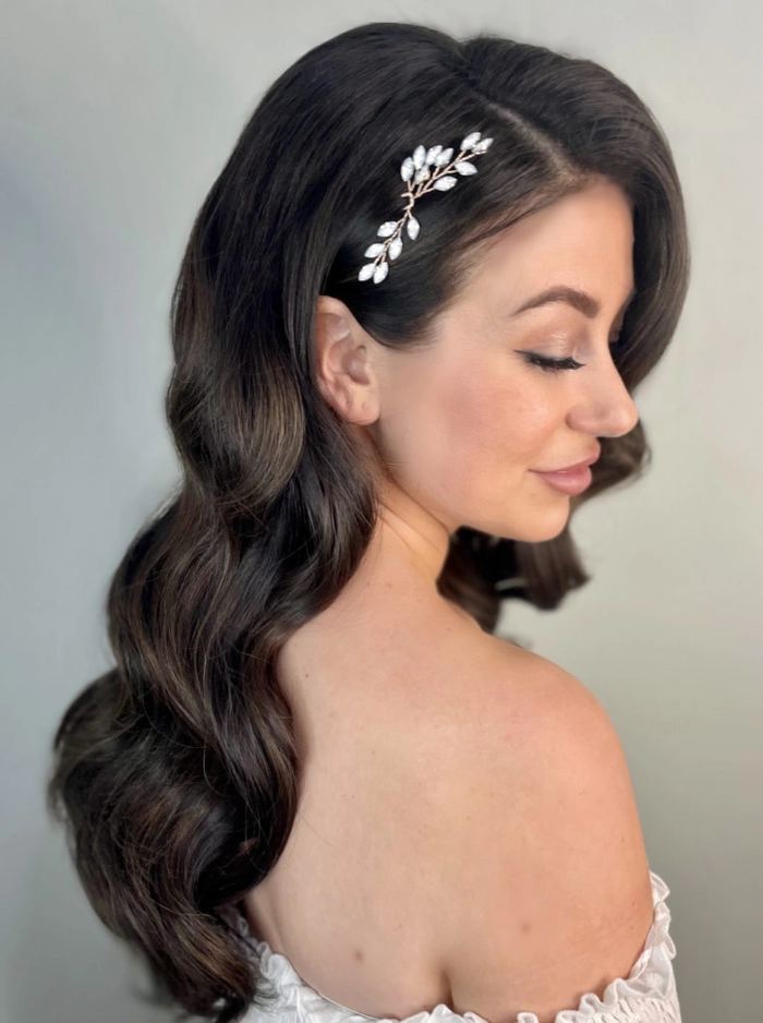 Elegant updo with soft curls showcasing prom hairstyles for off the shoulder dresses