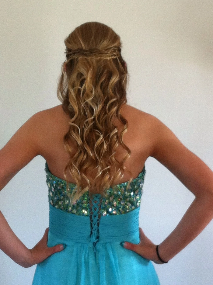 Elegant updo showcasing prom hairstyles for strapless prom dresses