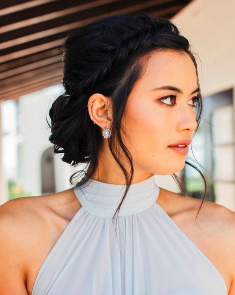 Elegant updo hairstyle perfect for prom with a halter neck dress