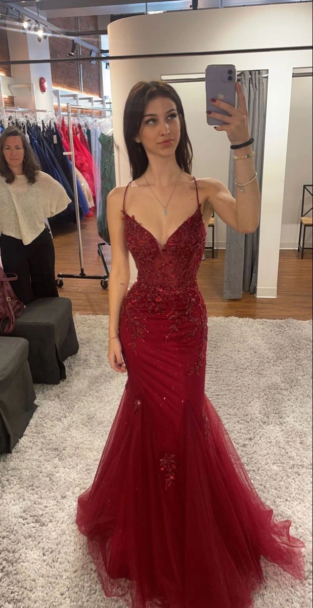 Elegant updo hairstyle perfect for prom to match a red dress