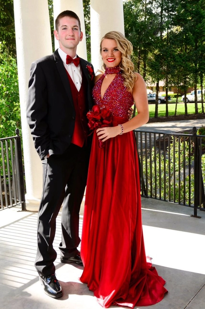 Elegant updo with soft curls perfect for prom hairstyles to match a red dress