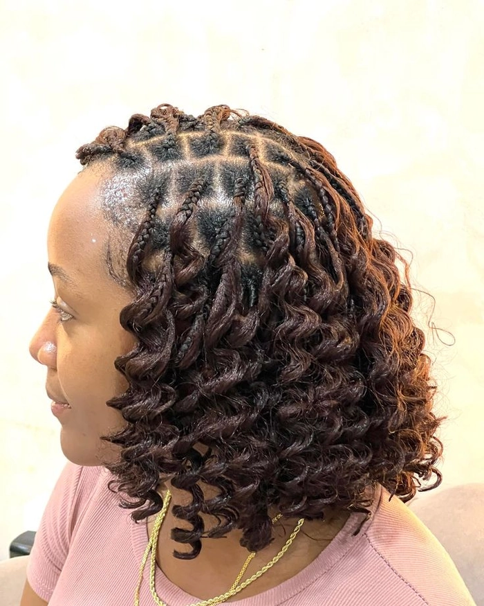 Ethereal goddess braided prom hairstyle with soft waves and floral accents
