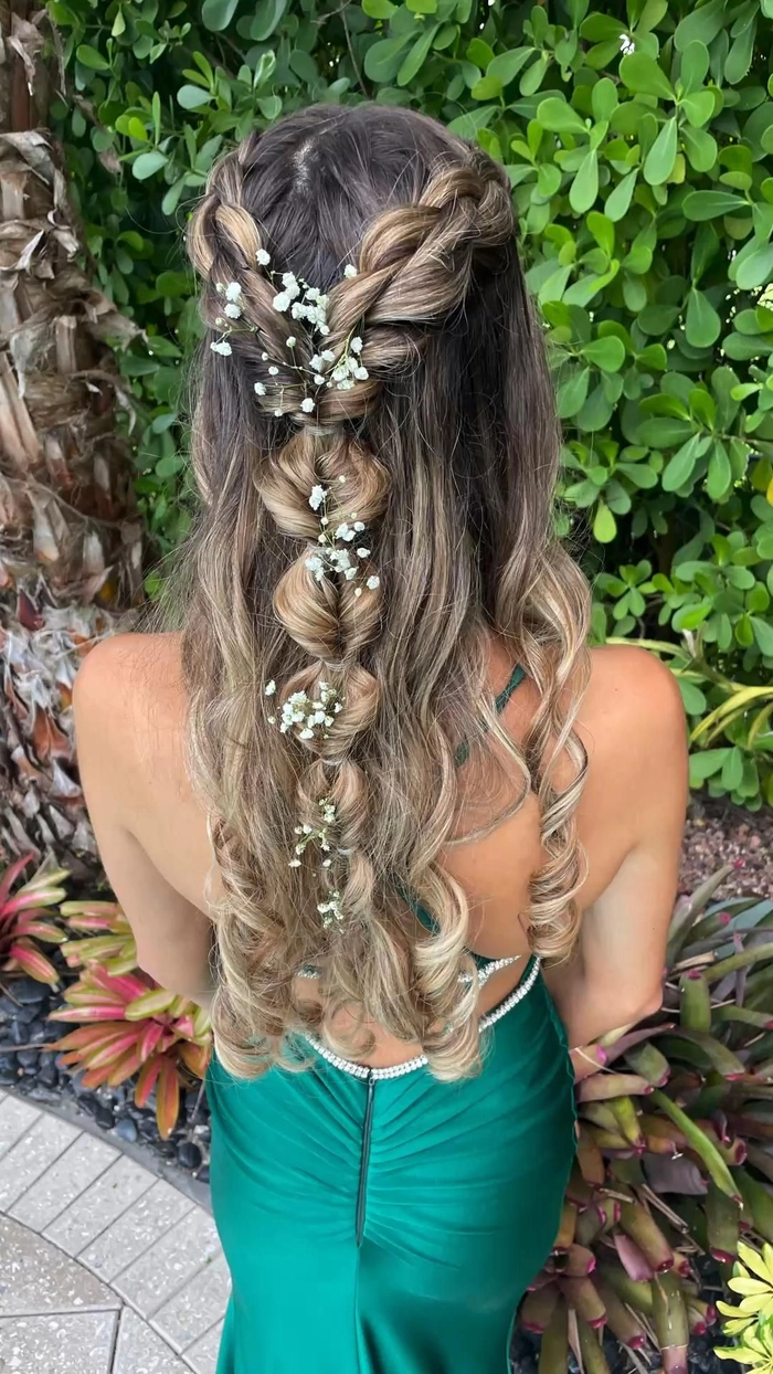 Ethereal goddess braided prom hairstyle with intricate twists and soft waves