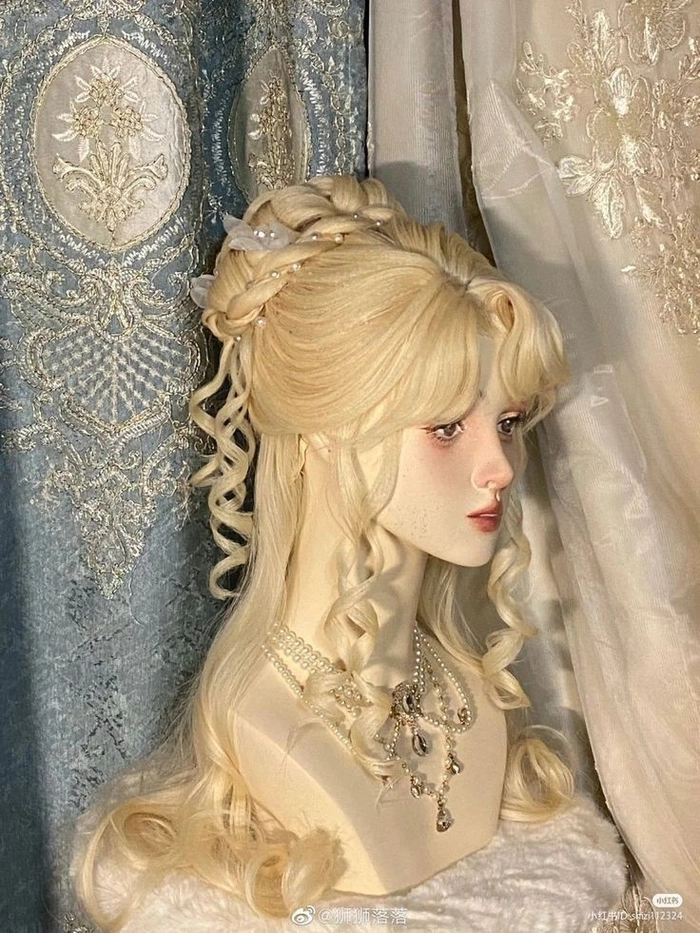 Elegant romantic fairy tale princess prom hairstyle with soft curls and floral accents