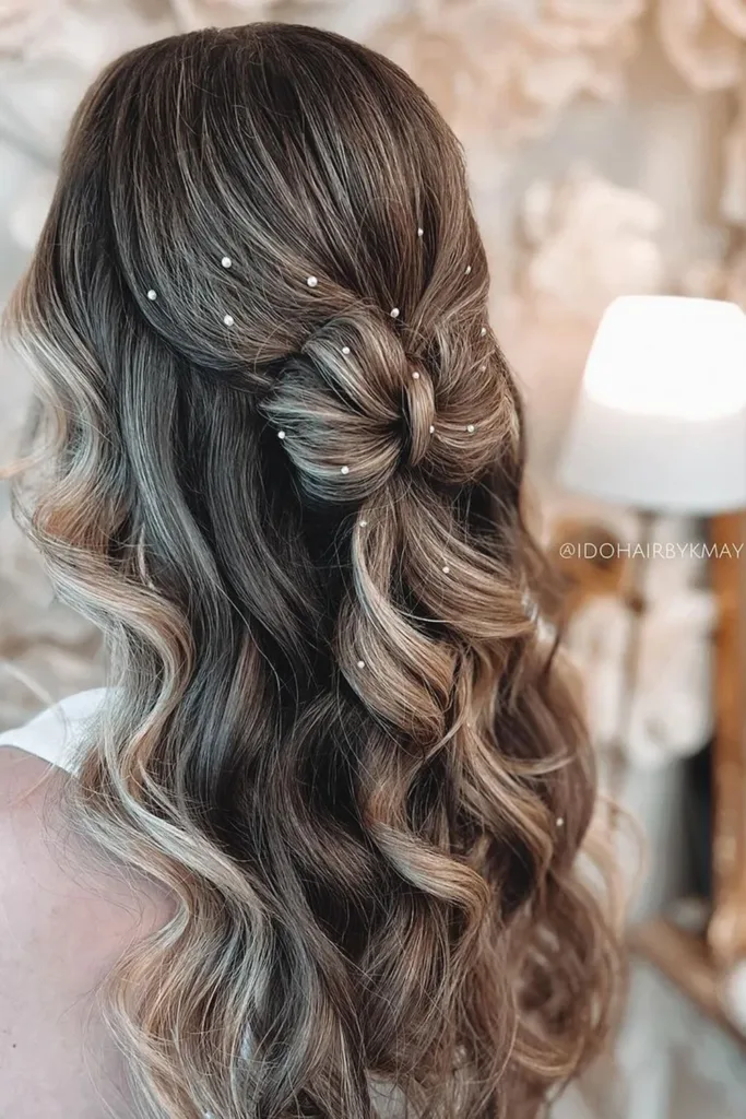 Stylish curled half up half down prom look for special occasions Elegant half up half down prom hairstyle featuring soft curls