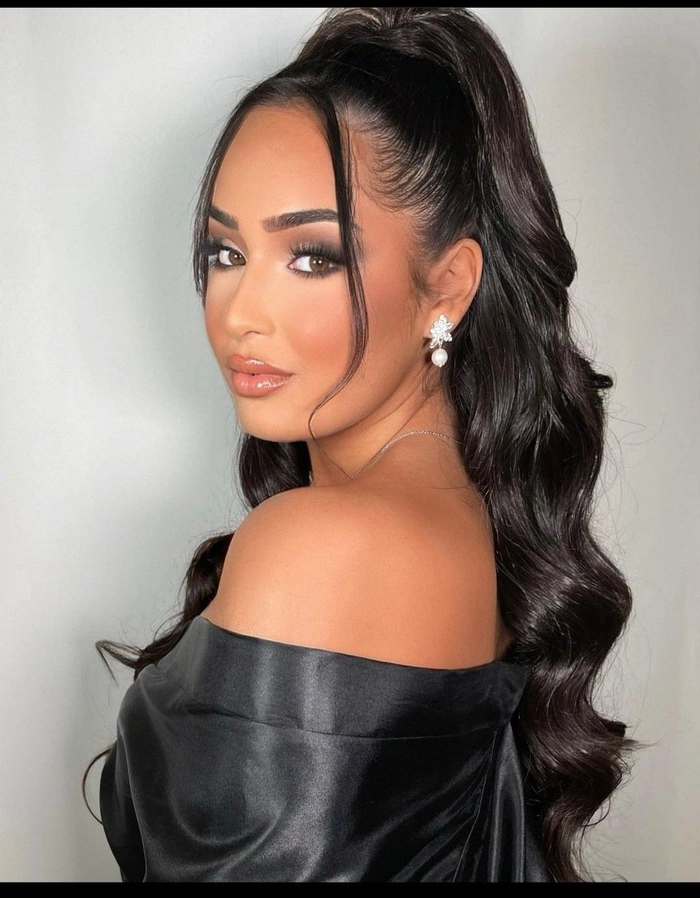 Elegant high sleek ponytail for prom hairstyle perfect for a polished and chic look High sleek ponytail prom hairstyle showcasing smooth and shiny hair with elegant volume