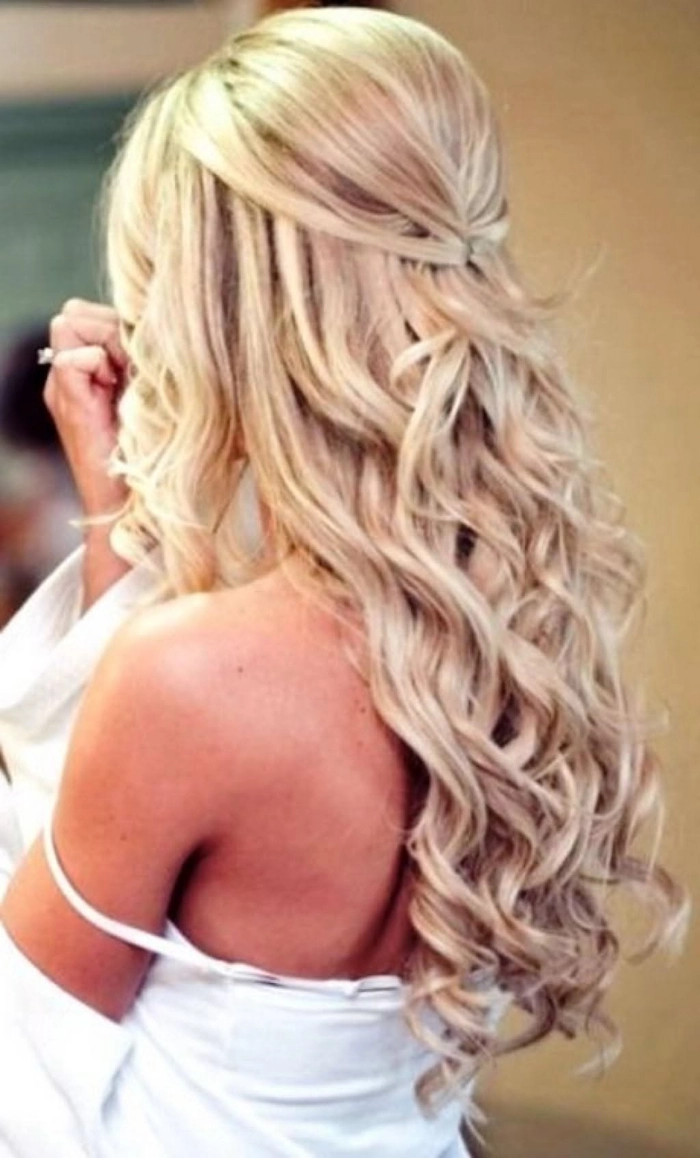 Long prom hairstyles for natural curly hair with elegant curls and volume