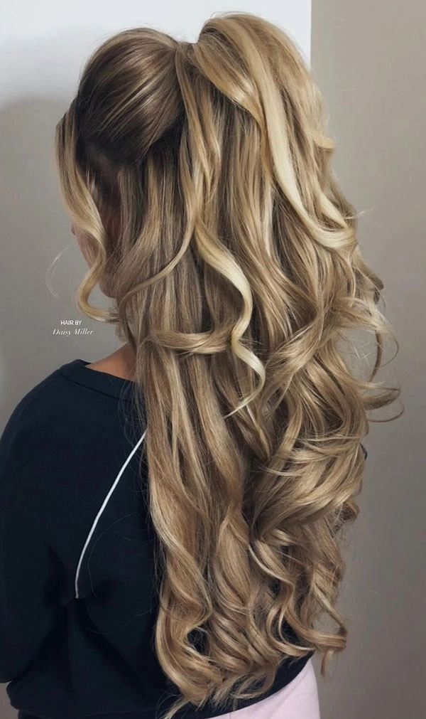 Long prom hairstyles for natural curly hair with elegant curls and volume