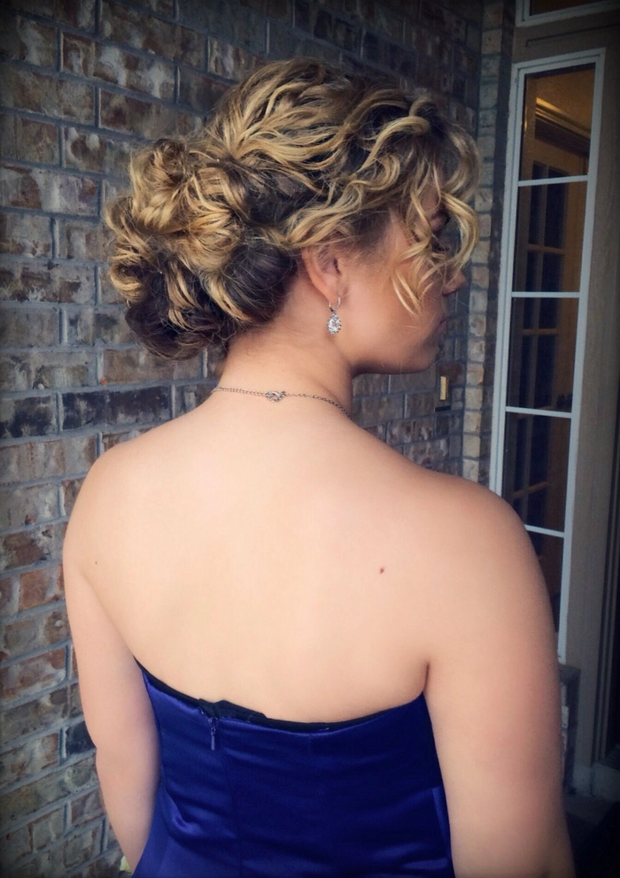 Sophisticated prom hairstyle perfect for a military ball event Elegant military ball formal hairstyle featuring a sleek updo with delicate curls