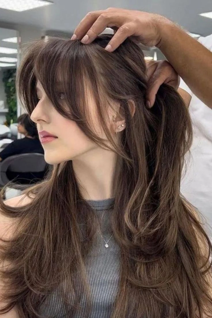 Stylish prom hairstyle incorporating bangs and a flowing curtain fringe for a trendy look Prom hairstyle featuring bangs and a curtain fringe styled elegantly for prom night