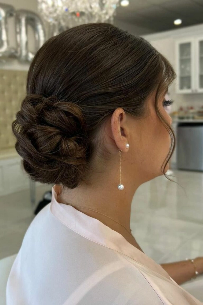 Prom hairstyle featuring elegant face framing tendrils for a stylish look