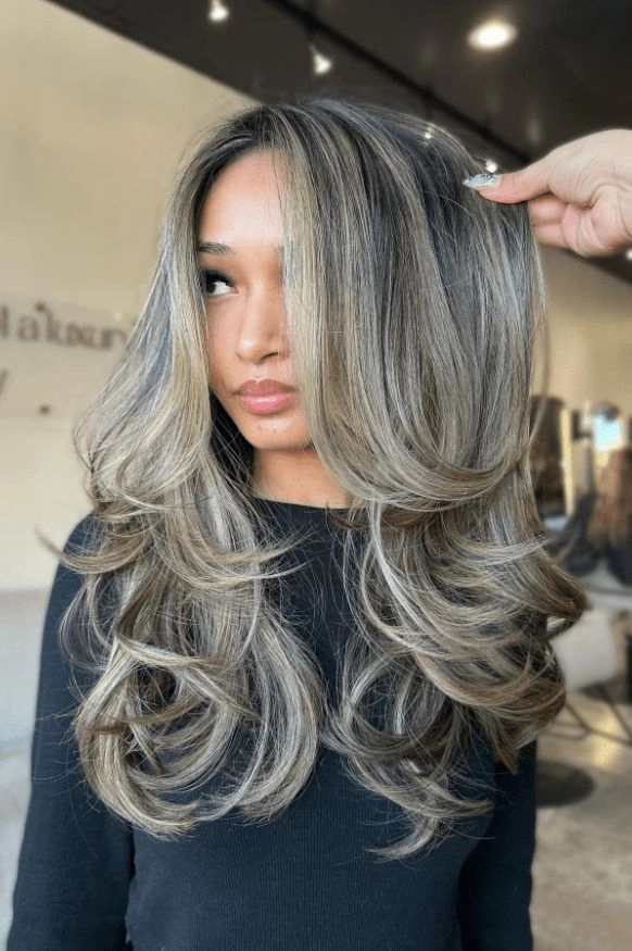 Elegant prom hairstyles for ash blonde highlights with soft curls and volume