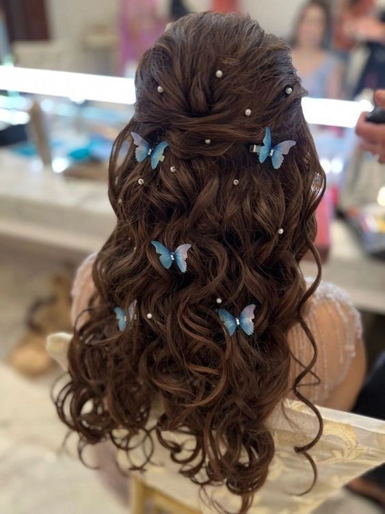 prom hairstyles with butterfly hair pins image