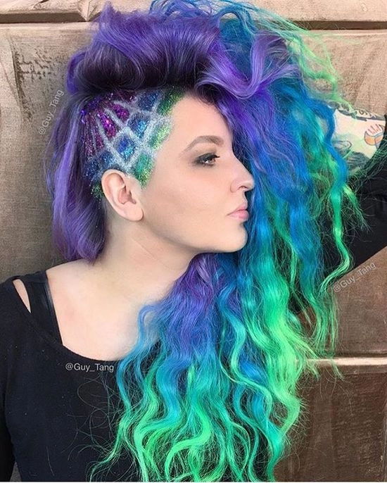 Prom hairstyle featuring vivid rainbow color treated hair styled in loose curls