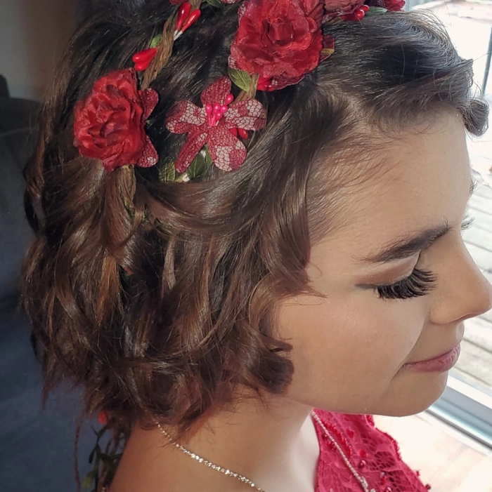 Stunning short layered hair styled into a chic prom updo for a special night Elegant prom updo for short layered hair with soft curls and volume