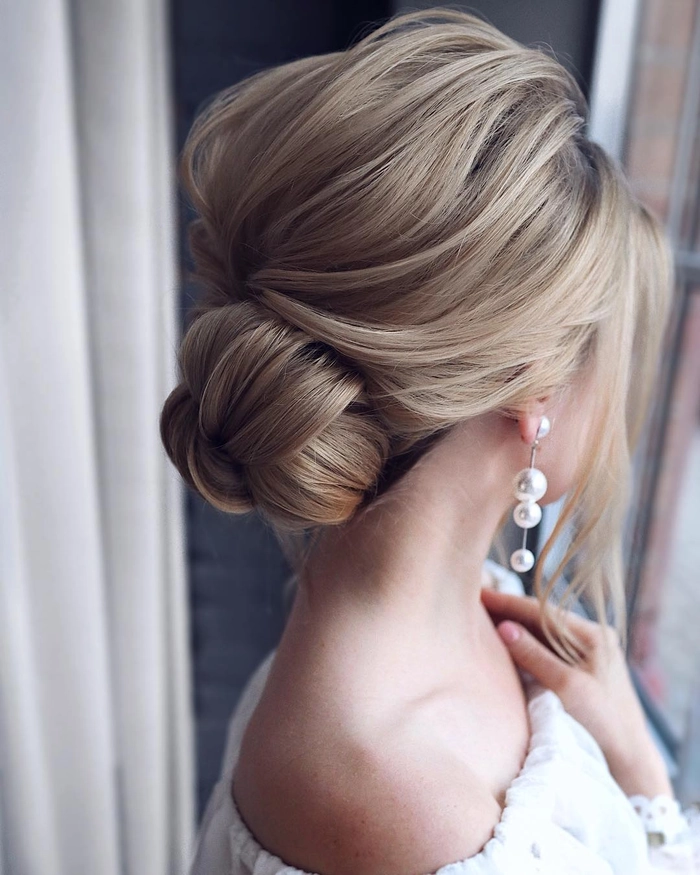 Stylish medium length prom updo perfect for thick hair textures Medium length prom updo hairstyle for thick hair with elegant curls