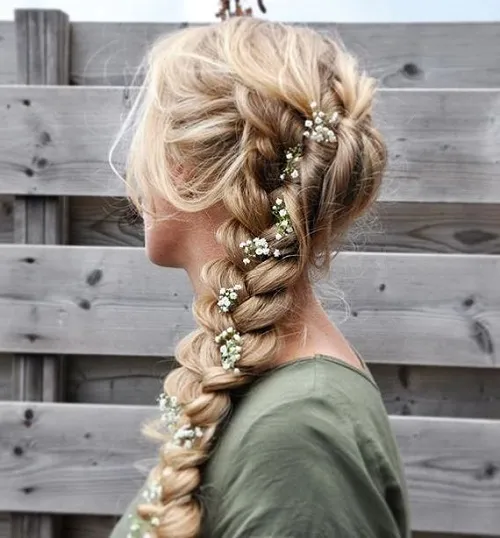 Romantic loose side swept prom hairstyle perfect for a formal event Elegant romantic loose side swept prom hairstyle with soft curls