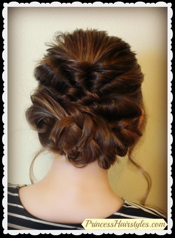 Elegant romantic fairy tale princess prom hairstyle with soft curls and floral accents