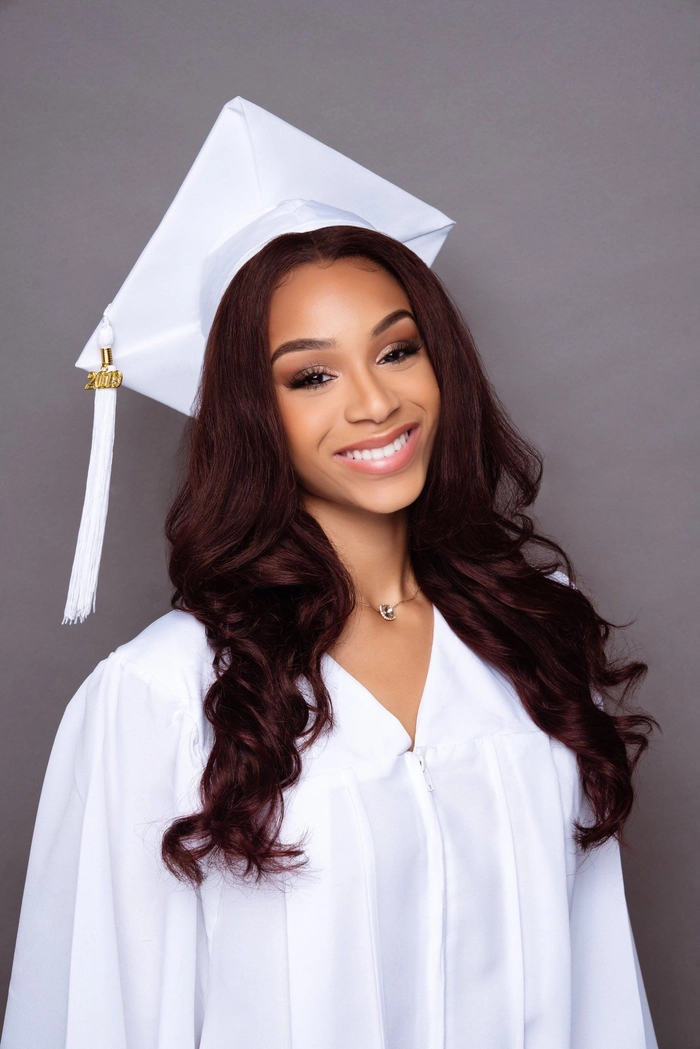 Stunning prom hair design perfect for a memorable senior night celebration Elegant senior prom hairstyle with loose curls and floral accessories for high school graduates