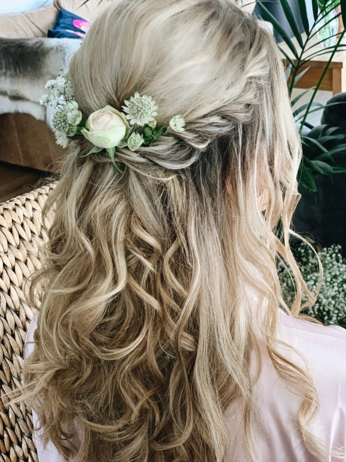 Spring prom hairstyle featuring vibrant fresh flowers for a stunning seasonal style Elegant spring prom hairstyle adorned with fresh blooms for a soft, romantic look