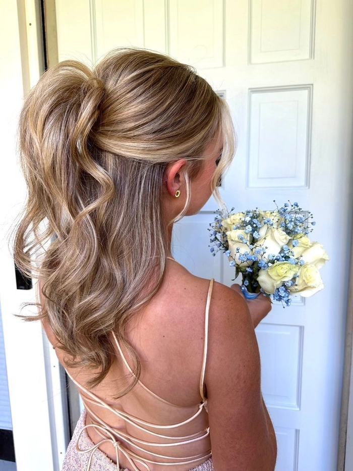 Spring Prom Hairstyles with Fresh Blooms Inspiration Image 11 Elegant spring prom hairstyle adorned with fresh blooms for a radiant look