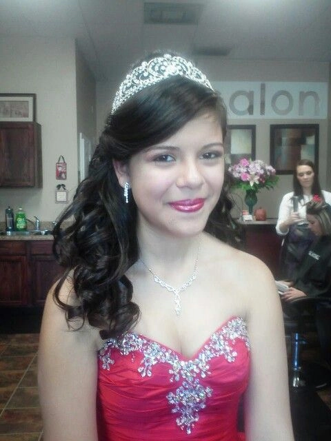 Stunning prom hairstyle inspiration for sweet sixteen celebrations Elegant sweet sixteen formal hairstyle with intricate curls and floral accessories