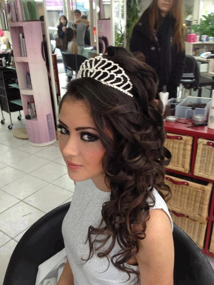 Prom hairstyles perfect for a sweet sixteen celebration look image 10 Sweet sixteen formal hairstyle with elegant curls and floral accessories