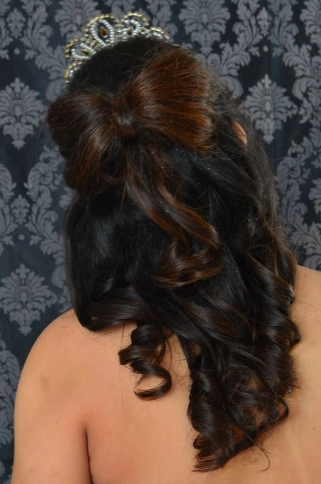 Chic prom hairstyle idea perfect for a sweet sixteen celebration Elegant sweet sixteen formal hairstyle with intricate curls and accessories