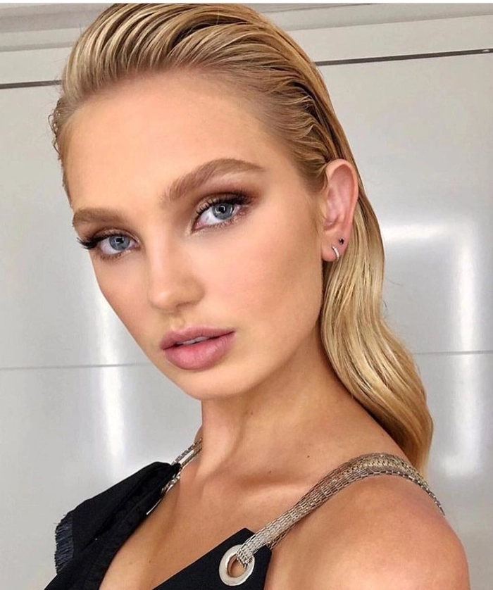 Elegant wet look slicked back prom hairstyle with glossy finish