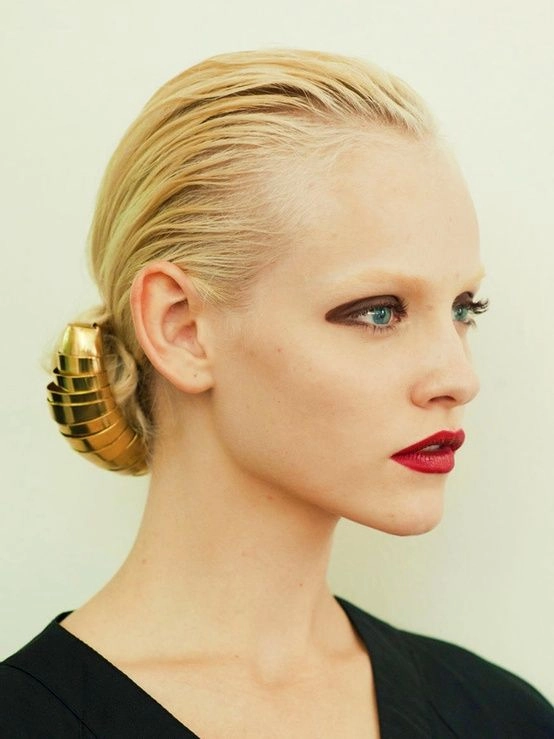 Elegant wet look slicked back prom hairstyle showcasing glossy, smooth hair