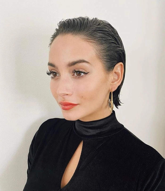 Wet look slicked back prom hairstyle featuring glossy and smooth hair
