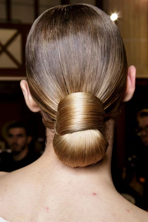 Woman with windproof outdoor prom hairstyle, side-swept waves and strong hold