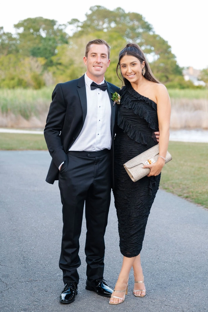Sophisticated wedding guest hairstyle perfect for a formal black tie event Elegant black tie wedding guest updo featuring a polished chignon with soft curls