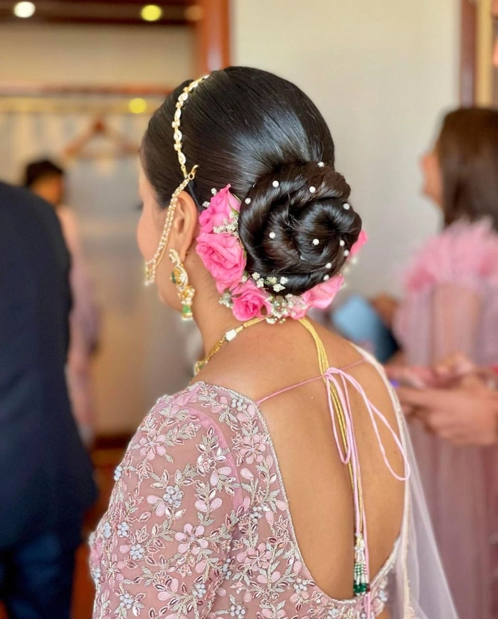 Boho braided wedding hair with soft waves and floral accents