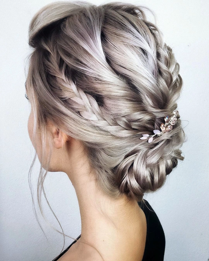 Boho braided wedding hair styled with loose waves and natural accents