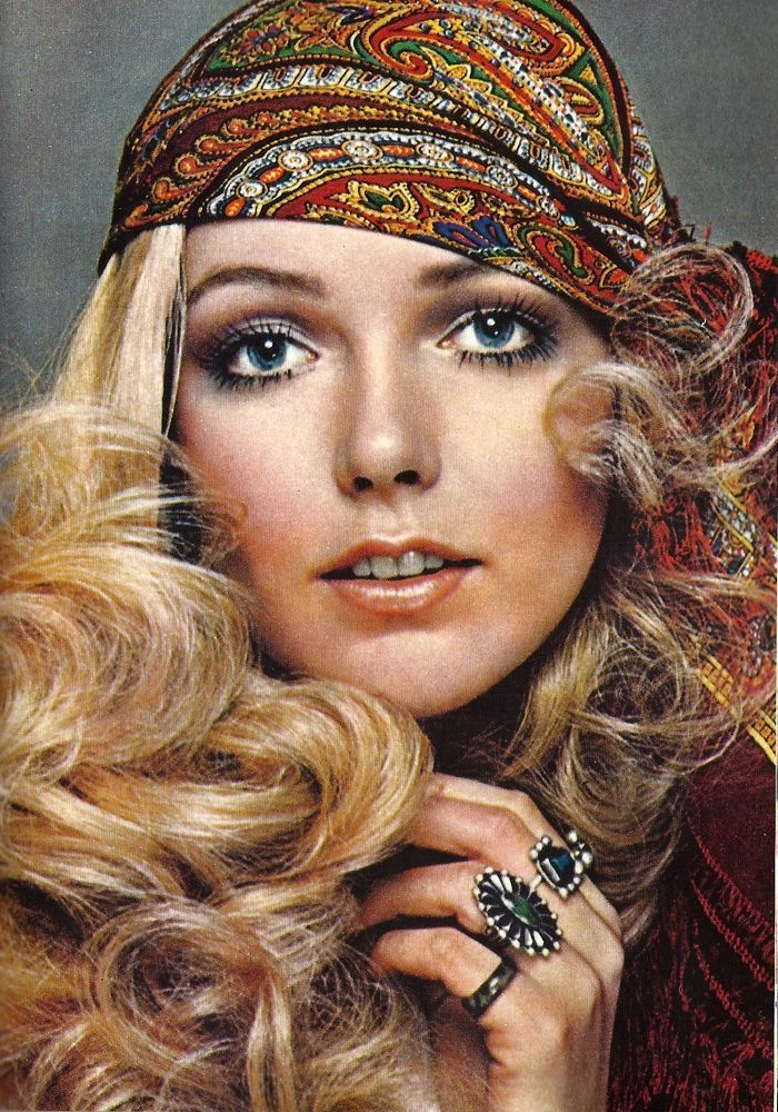 Bridal hairstyle inspired by the vibrant disco era with voluminous curls and sparkle