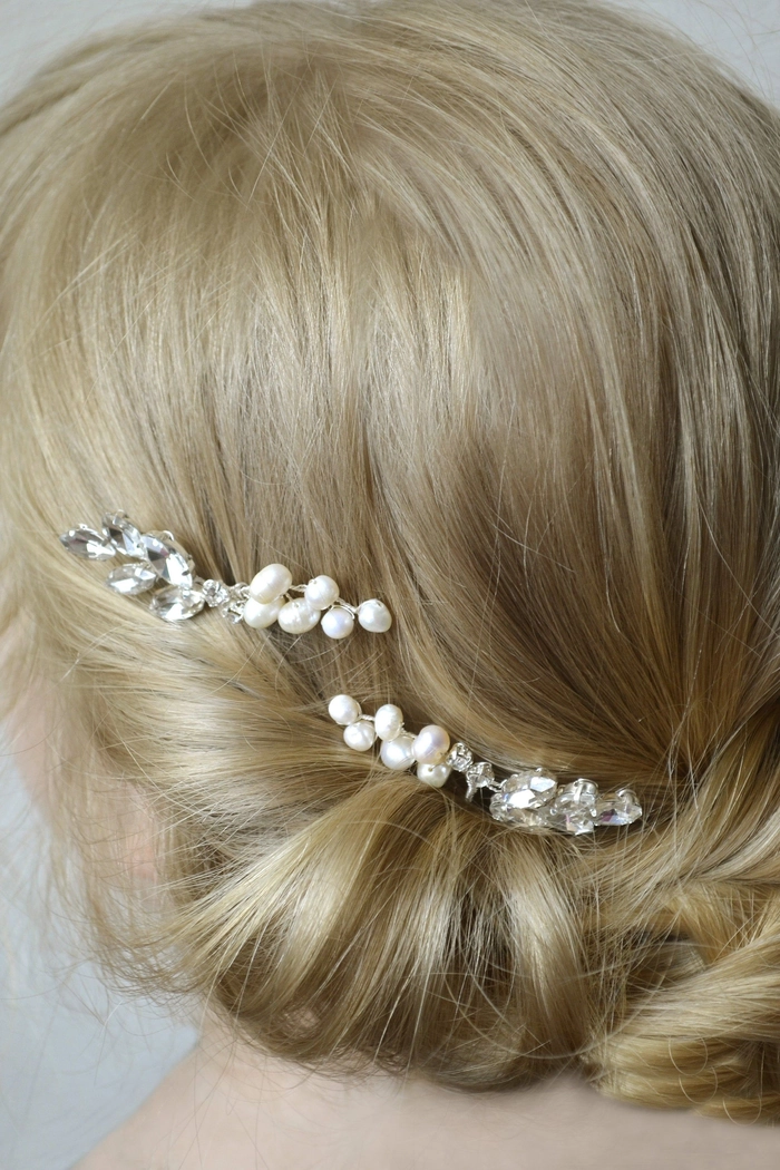 Stylish wedding hairstyle featuring pearl hair pins for a bride on her special day Elegant bridal hair adorned with delicate pearl hair pins for a timeless wedding look